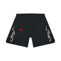 Black shorts with white tribal designs on a white background