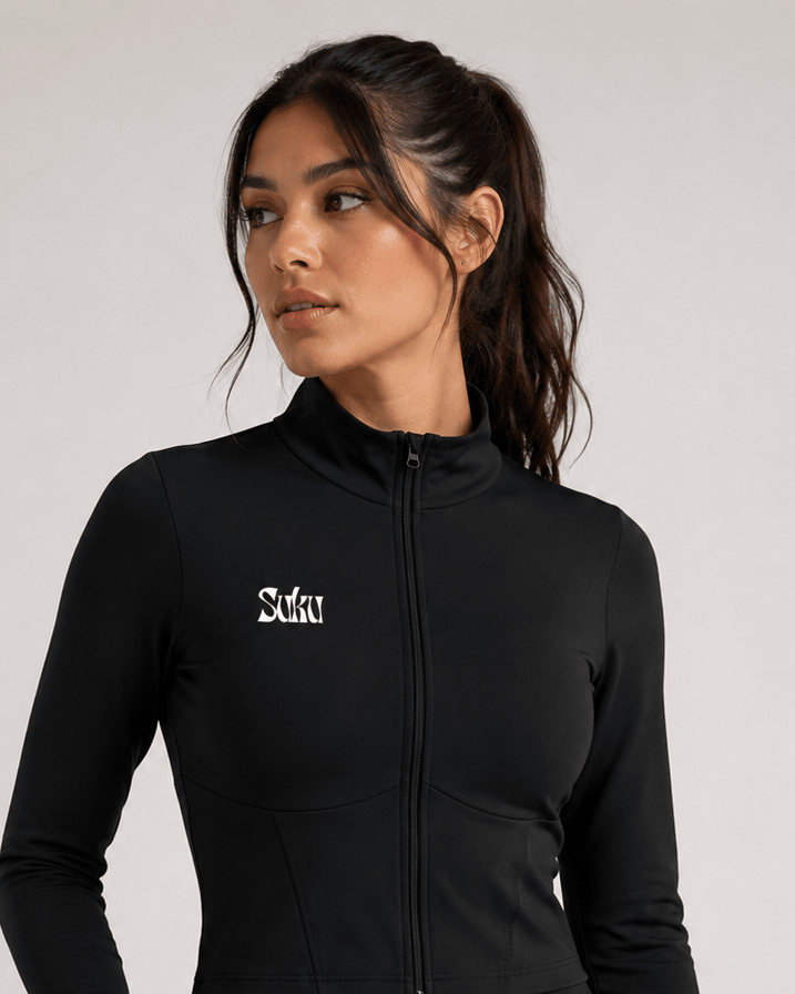 Black women's full-zip sports jacket by Suku, showing the sleek design and lightweight fabric perfect for active wear.