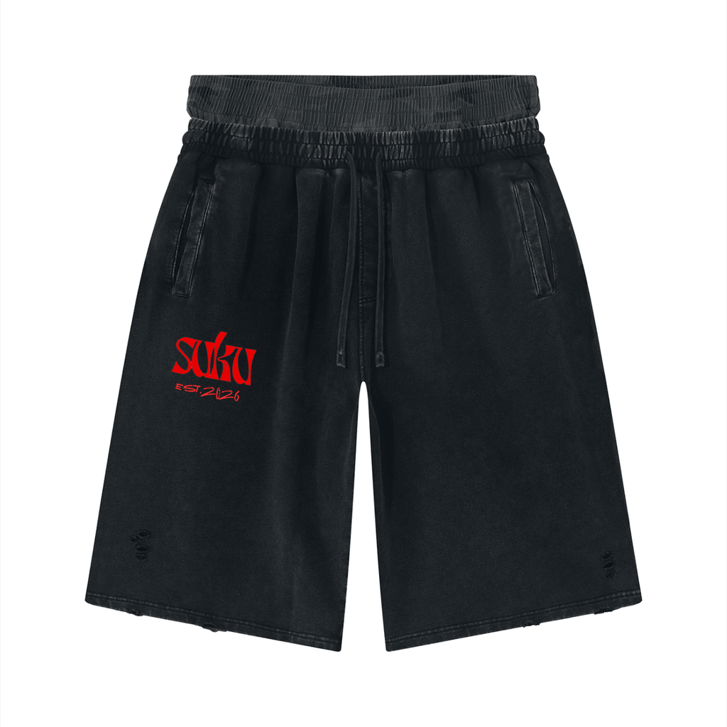 Unisex vintage wash distressed wide-leg shorts by Suku, featuring a relaxed fit and frayed hem, laid flat on a white background.